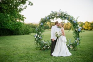 Bride-and-Groom-by-Floral-Archway