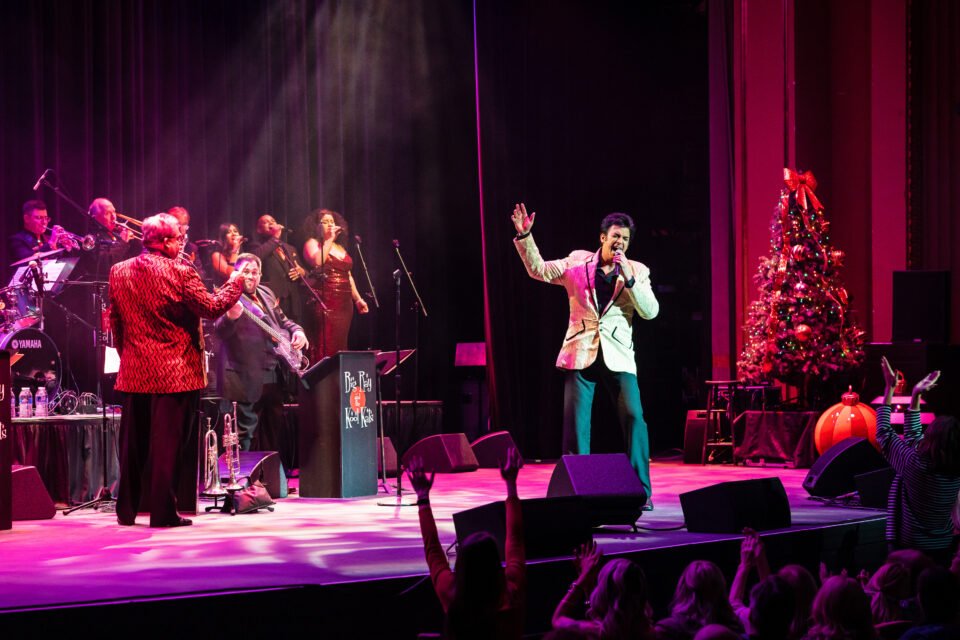 Matt Lewis as Elvis singing on stage
