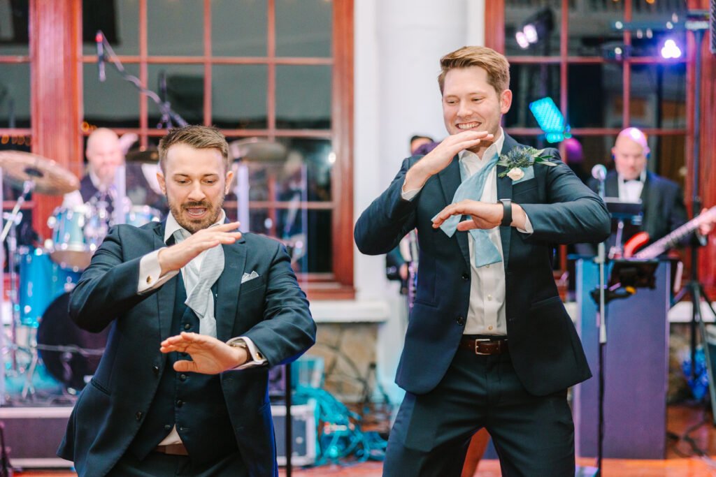 groom and groomsman dancing big ray and the kool kats raspberry plain manor wedding best wedding venue