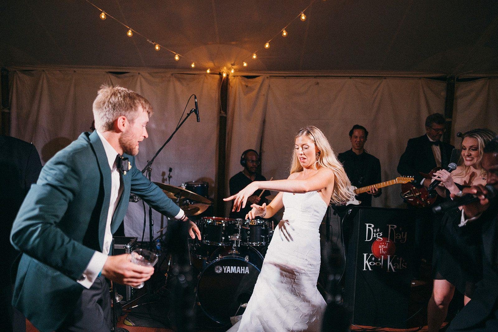 The Clifton weddings Big Ray and the Kool Kats bride and groom on stage